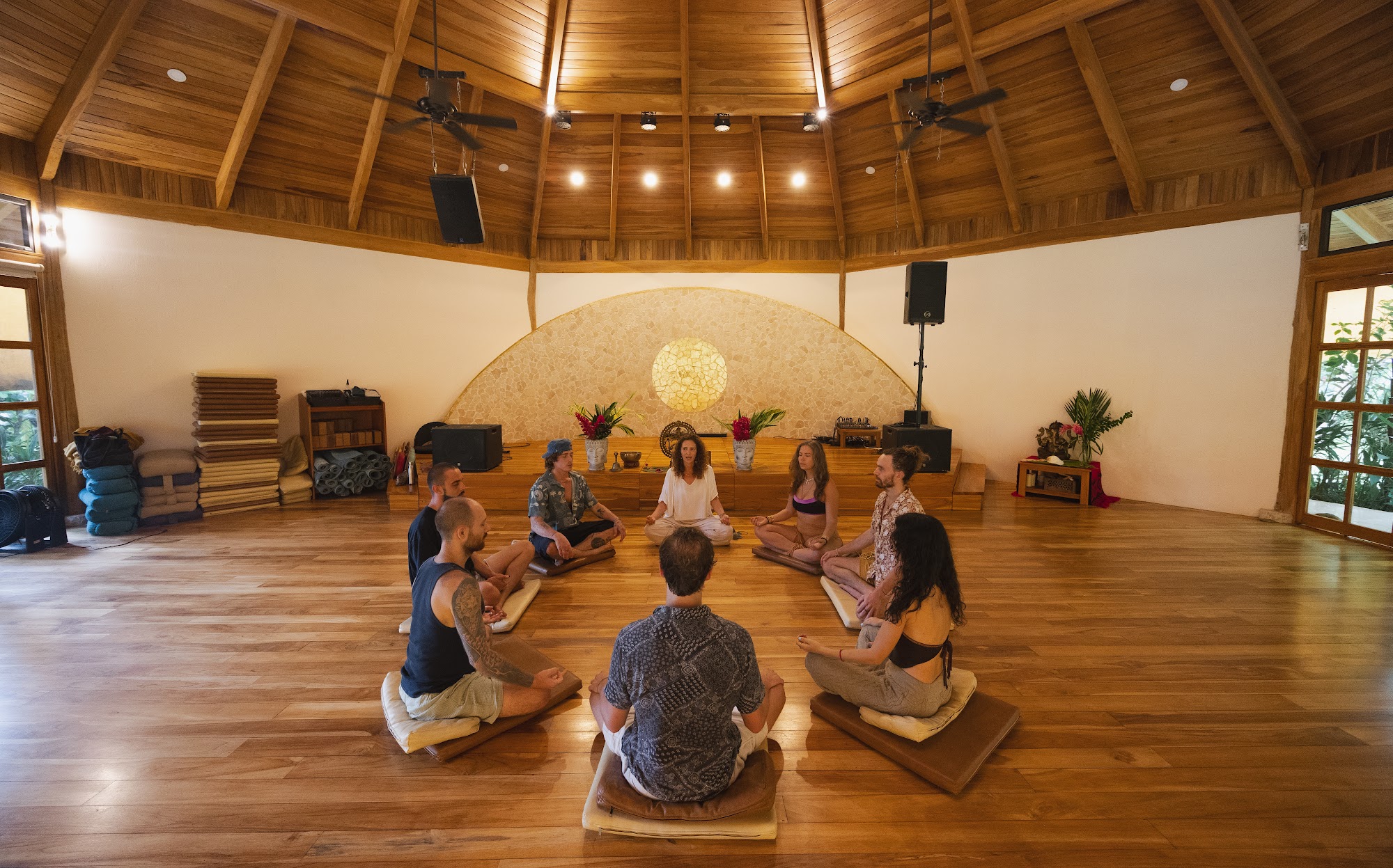 A meditation circle inside the octagonal wooden hall at Awake