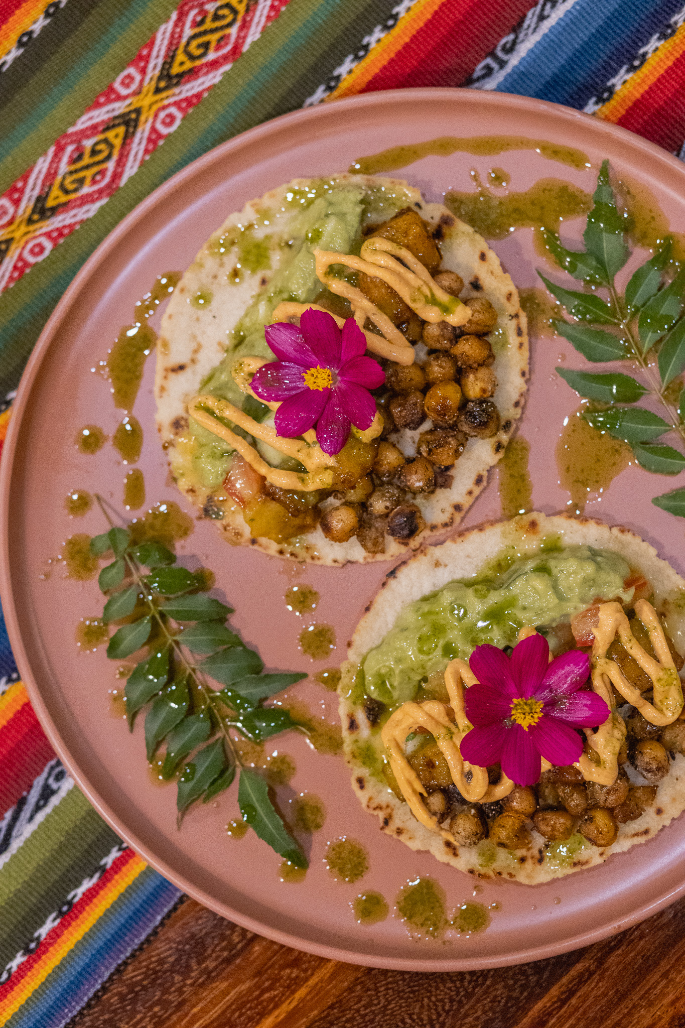 Plated tostadas with edible flowers from the Awake kitchen